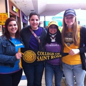 Best Buddies holding sign