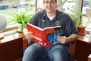 Freshman Student in Library w/book