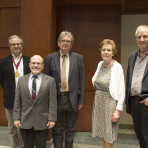Retiring faculty members line up for a photo