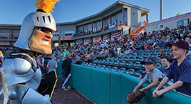 Fear the Saint Rose mascots playing with kids at a Tri-City Valleycats game