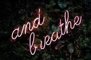 Picture of a sign, stating 'and breathe'